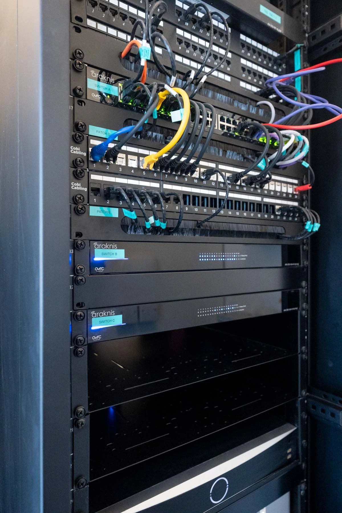 Professionally installed Araknis network equipment and cabling in a dedicated equipment rack